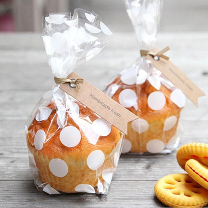 Sachet transparent pour confiserie et biscuit, motif pois blancs. Idéal pour un emballage cadeau de mariage ou baptême.